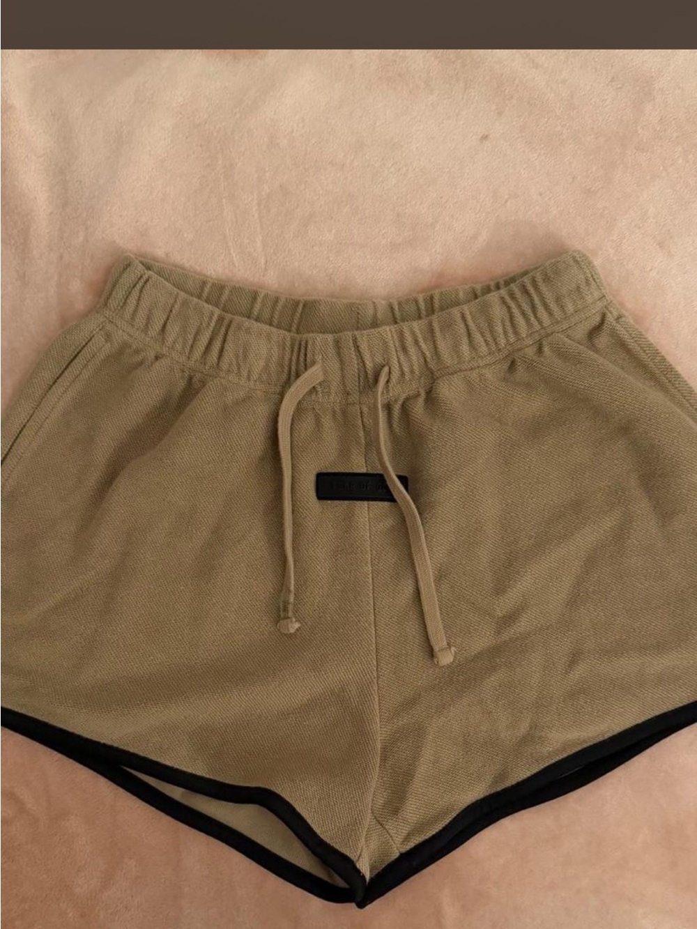 Fear of god essentials women shorts in khaki size small.